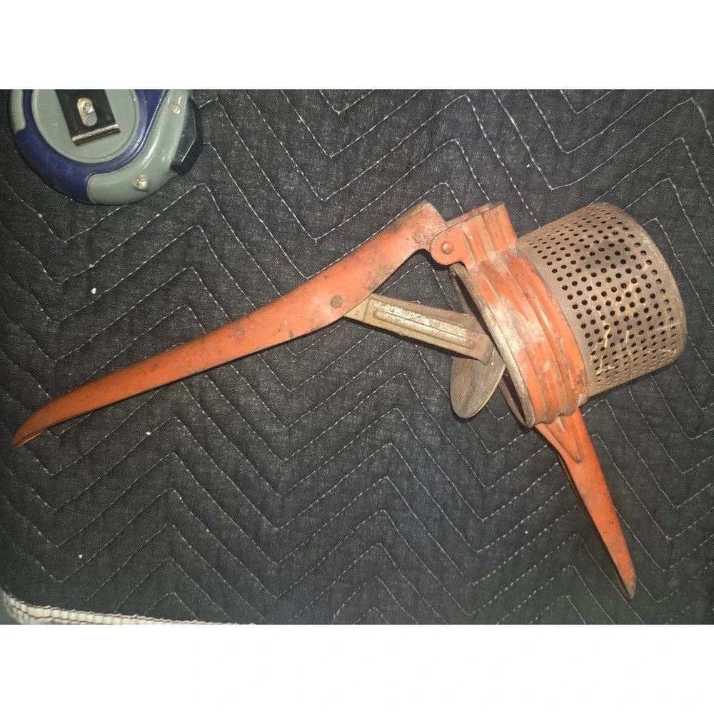 Vtg Orange Cast Metal Potato Ricer Fruit Press Hand Tool Rustic Kitchen Decor